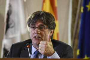 Fugitive Catalan chief Puigdemont pledges he will return to Spain if he can be restored to power
