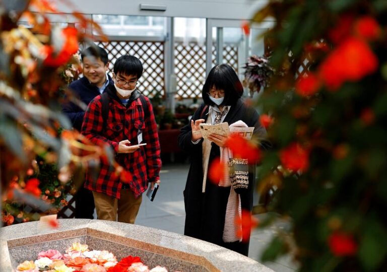 Participants take part in a matchmaking event using mystery solving game, which is organized by Tokyo metropolitan government at Jindai Botanical Gardens in Tokyo