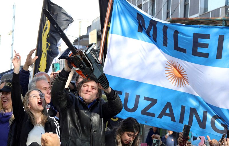FILE PHOTO: Argentine presidential candidate Javier Milei meets supporters during a campaign rally, in Buenos Aires