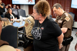 As her child cried, woman escorted by OHP troopers out of a state education board meeting