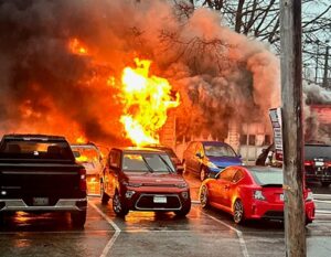 A fire burns a storage garage in Kittery, Maine, Friday, April 12, 2024.
