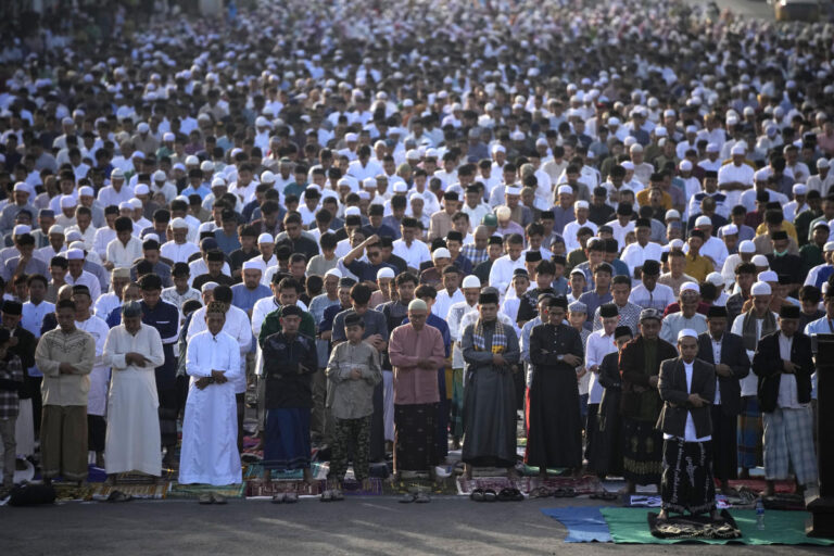 Muslims celebrate Eid al-Fitr with family reunions, new clothes, treats and prayers