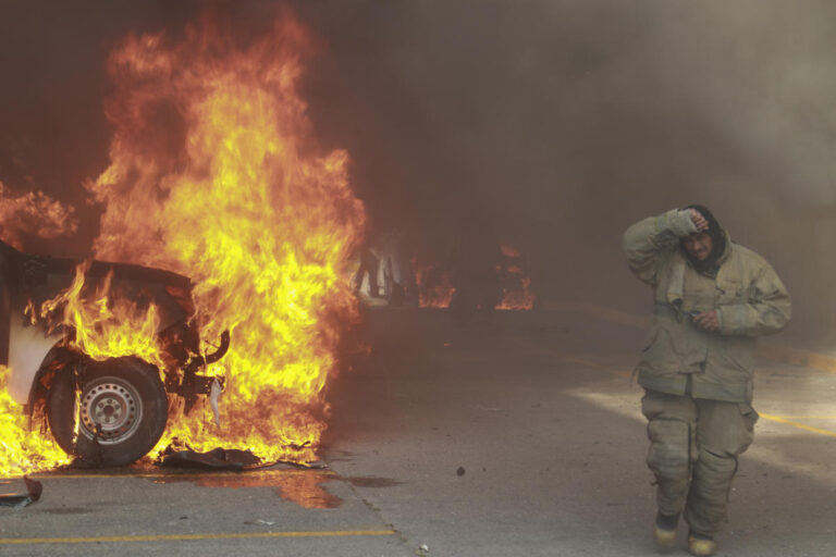 Protesters in southern Mexico set state government building afire and torch a dozen vehicles