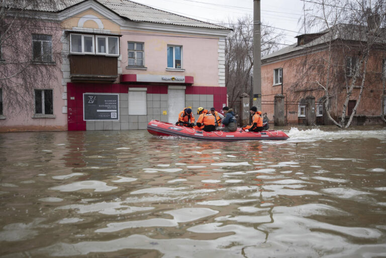 Russians stage a rare protest after a dam bursts and homes flood near the Kazakh border