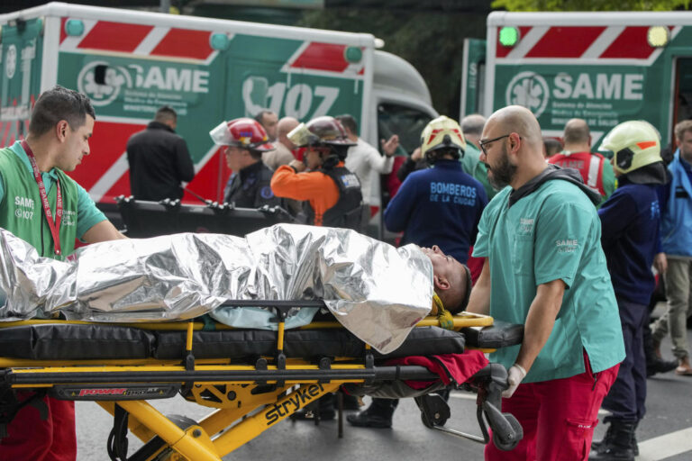 A train in central Buenos Aires strikes a boxcar on the track, injuring dozens