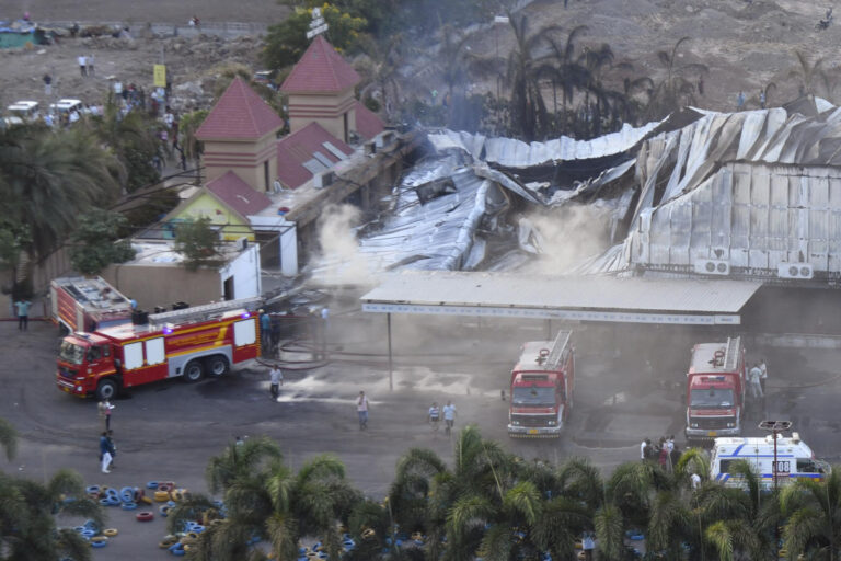 At least 20 dead in a fire in an amusement park in western India, police say.