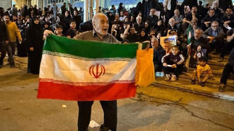 An Iranian man taking part in funeral processions for President Raisi