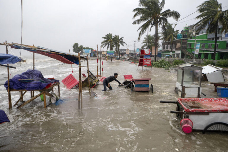 Cyclone floods coastal villages and cuts power in Bangladesh, where 800,000 had evacuated