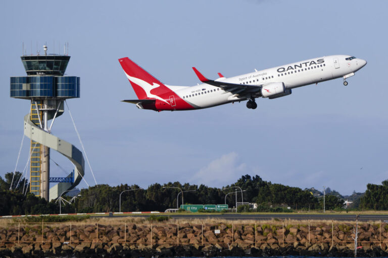 Qantas agrees to pay $79 million in compensation and a fine for selling seats on canceled flights