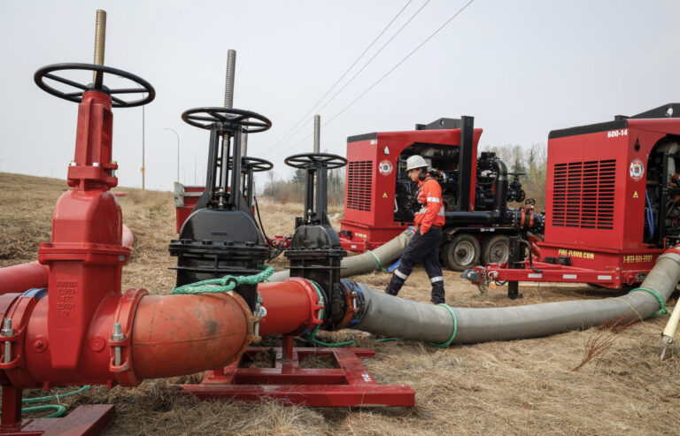 Rain, cooler temperatures help prevent wildfire near Canada's oil sands from growing