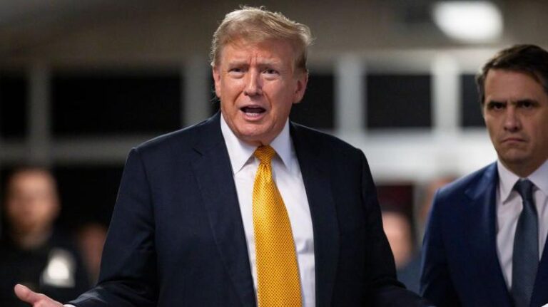 Former US President Donald Trump talks to the press while standing with his attorney Todd Blanche at the end of the day at his criminal trial at Manhattan Criminal Court on May 21, 2024