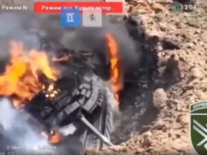A Russian tank stuck in a large crater became a sitting duck for Ukraine's drones, a video appears to show