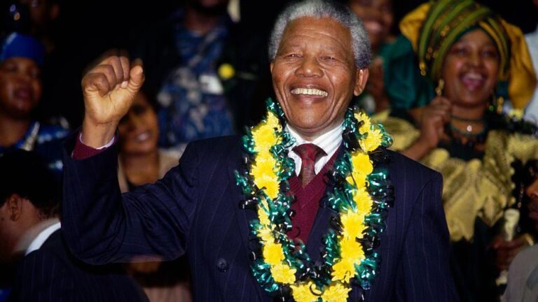 Winnie Mandela cheers her husband Nelson Mandela during his first ANC Conference in thirty year